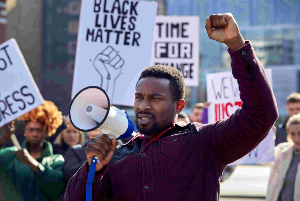 black man protesting with a megaphone